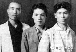 black and white photograph and three men standing beside one another