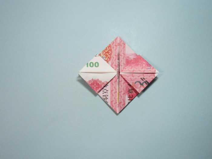 用人民币折纸爱心详细图解 放在钱包里的爱心