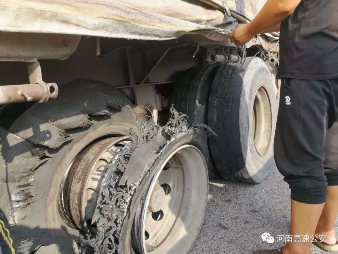 closeup damaged 18 wheeler semi truck burst tires by highway str - McEwen & Kestner, PLLC