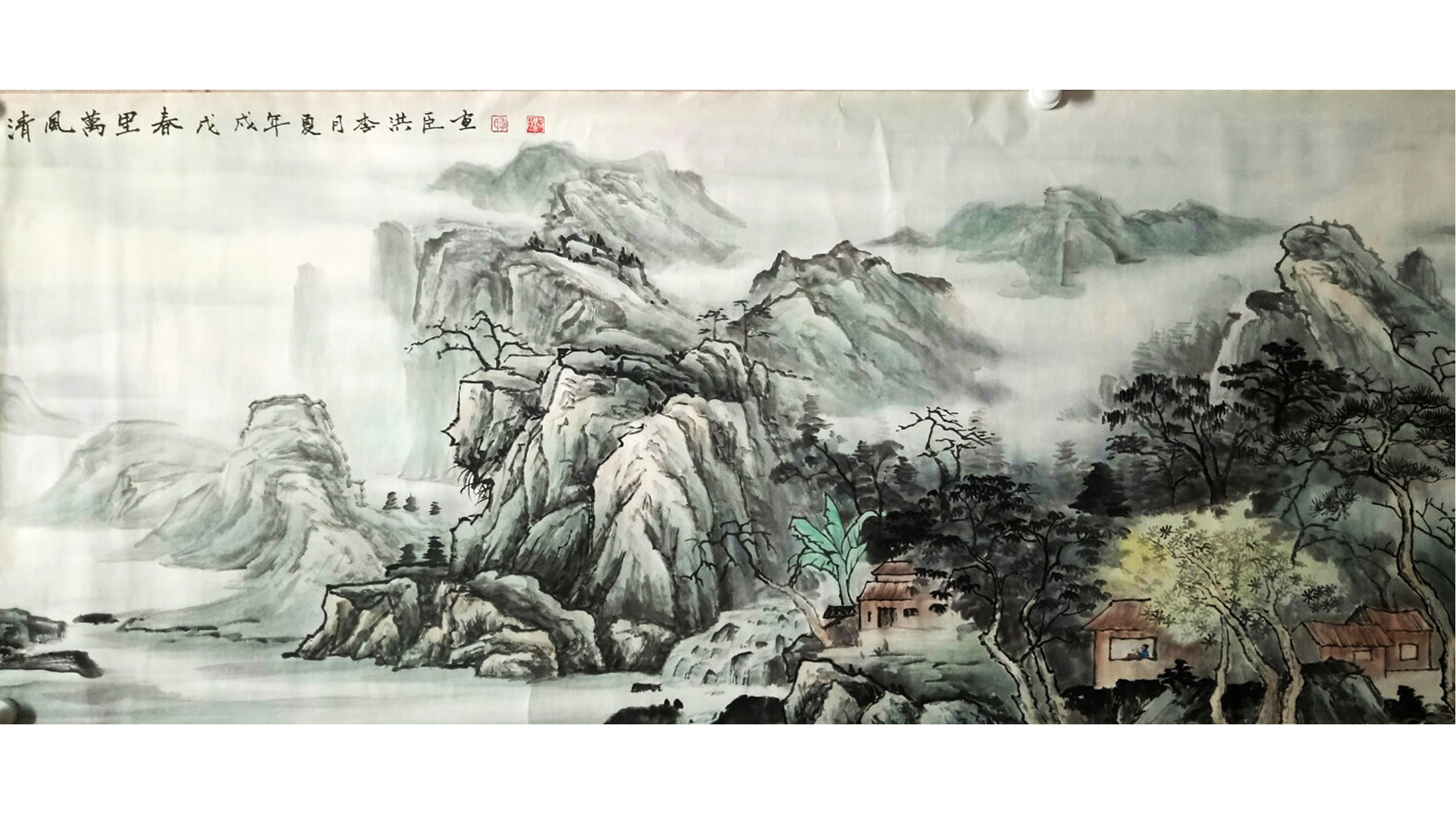 画家李洪臣与自己山水画作品的合影组图