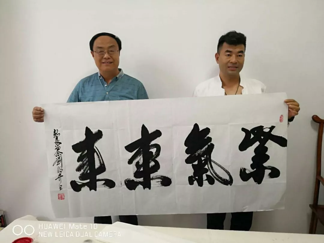 刘明奇到河南濮阳助力商企文化_书法艺术