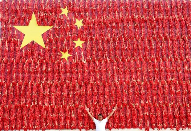 国庆前夕,在江苏南通的如皋县,是实实在在的幸福感,让五星红旗飘扬在