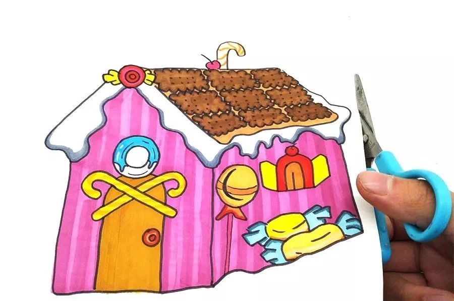 第三步,用粉色画出糖果屋的整体颜色,并用剪刀将其剪下.