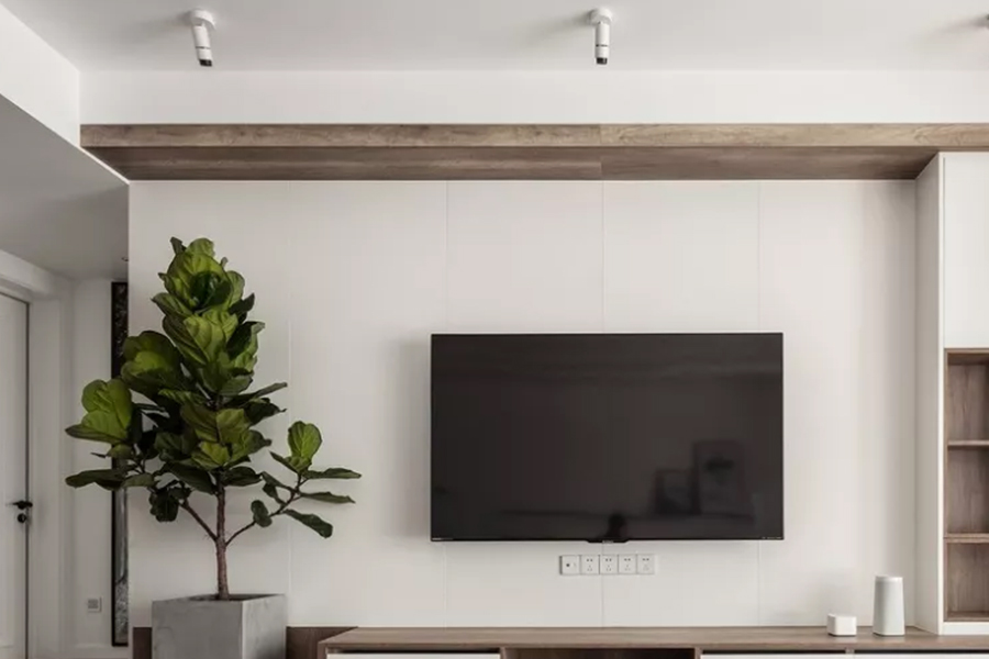 日式风格直接用大白墙做电视背景,然后通过原木色的电视柜和其他