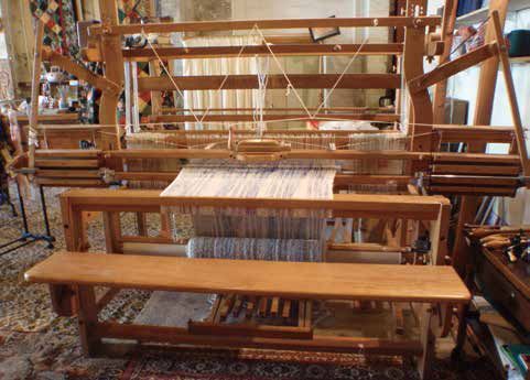 一台采取了约翰·凯伊发明的飞梭的织布机