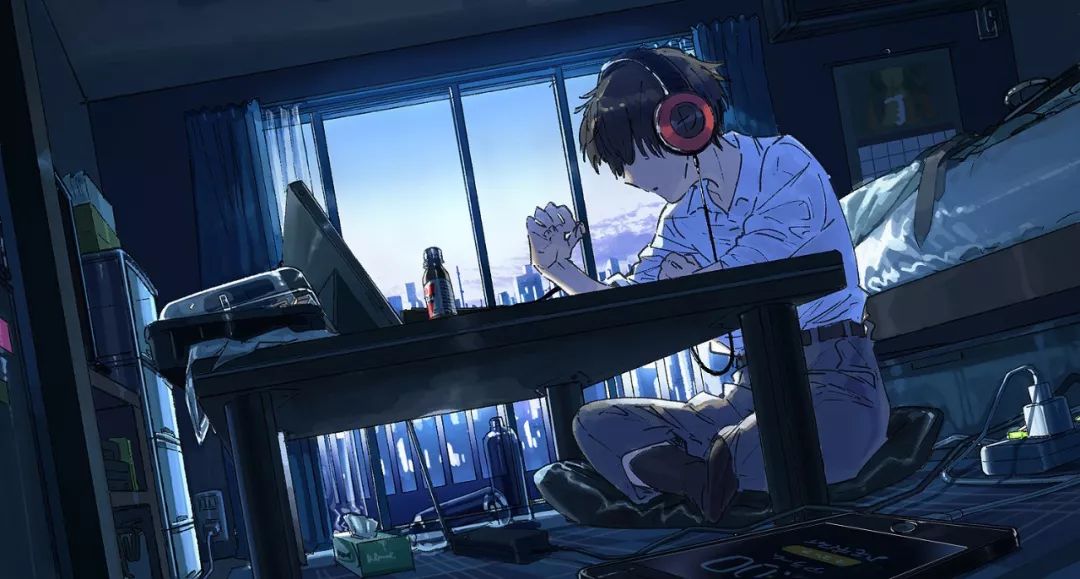 一个人书桌前听音乐