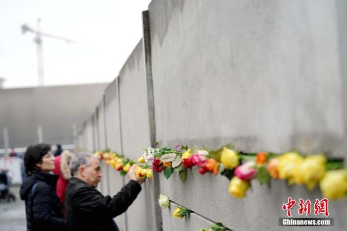柏林墙倒塌30周年默克尔承认东西德融合可能要很久