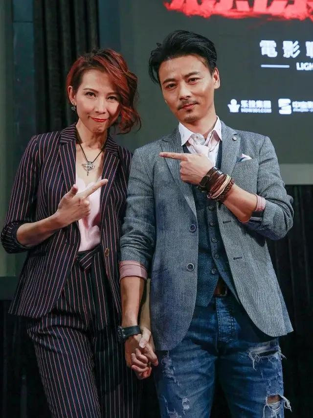 蔡少芬皮肤暗黄，身穿条纹西装内搭浅粉色，是