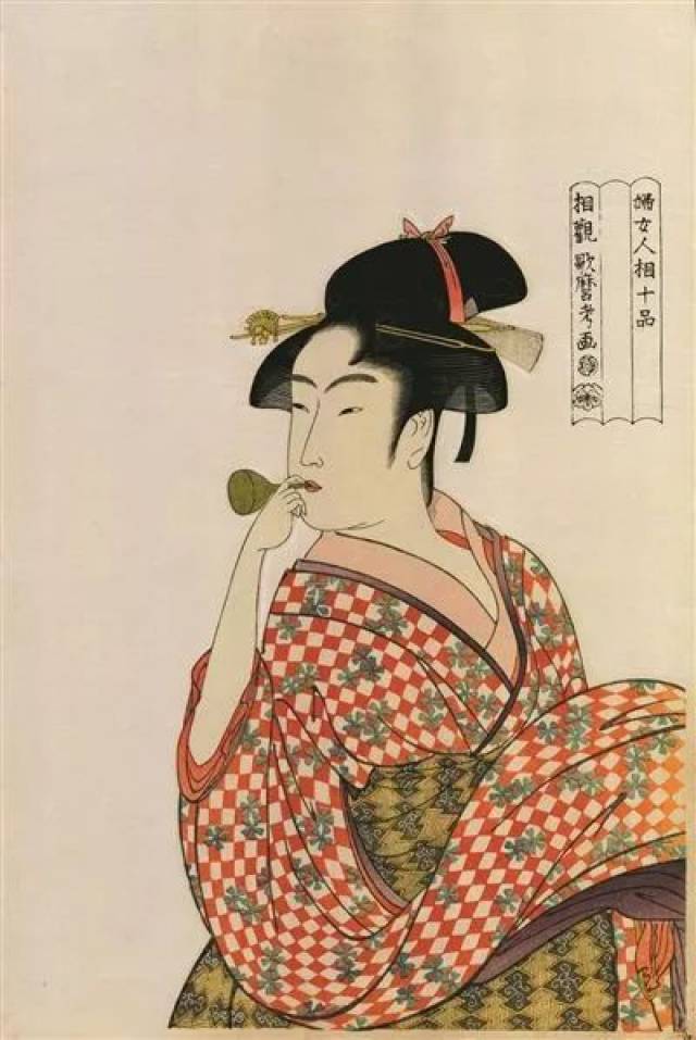 这是日本风俗画家喜多川歌磨(1753年-1806年)的木板画,这位穿和服的