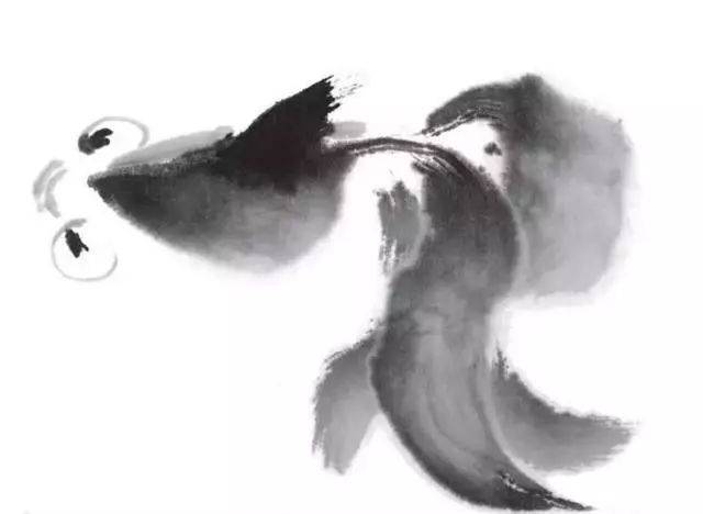 4.调重墨点画金鱼的眼珠,然后调淡墨画金鱼的头部另一侧.