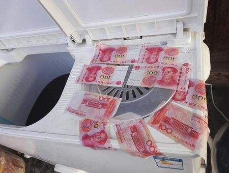 洗衣机把钱洗烂了图片图片