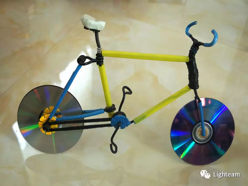 用光盘做的手工自行车图片