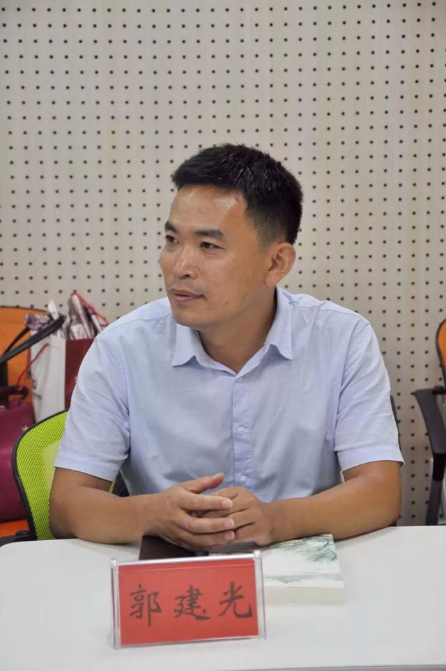 研讨会|做个有根深情之人那是回声那是故乡——青年作家郭建光新书发布会有感