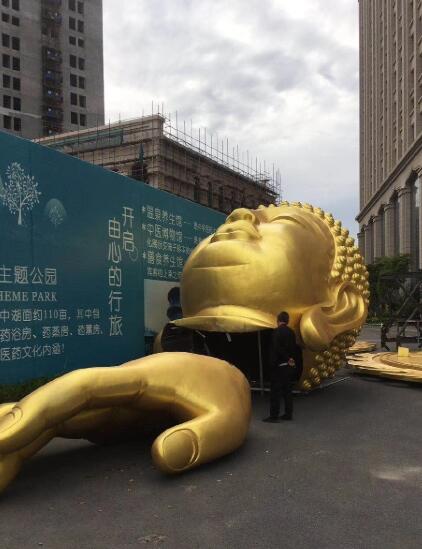 盐城:造价2000万的权健华东总部双面佛像正在移除
