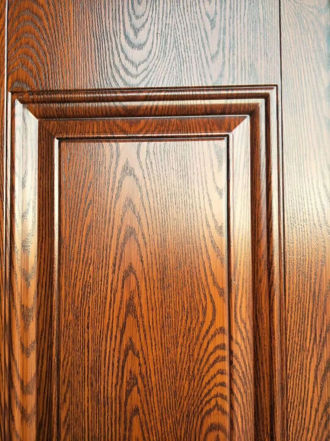 为什么精雕木纹板做的防盗门非标大门价格要卖的高点