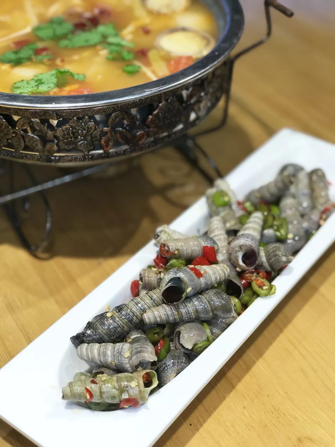 钉螺下酒鲜香麻辣吸着吃也是饶有趣味