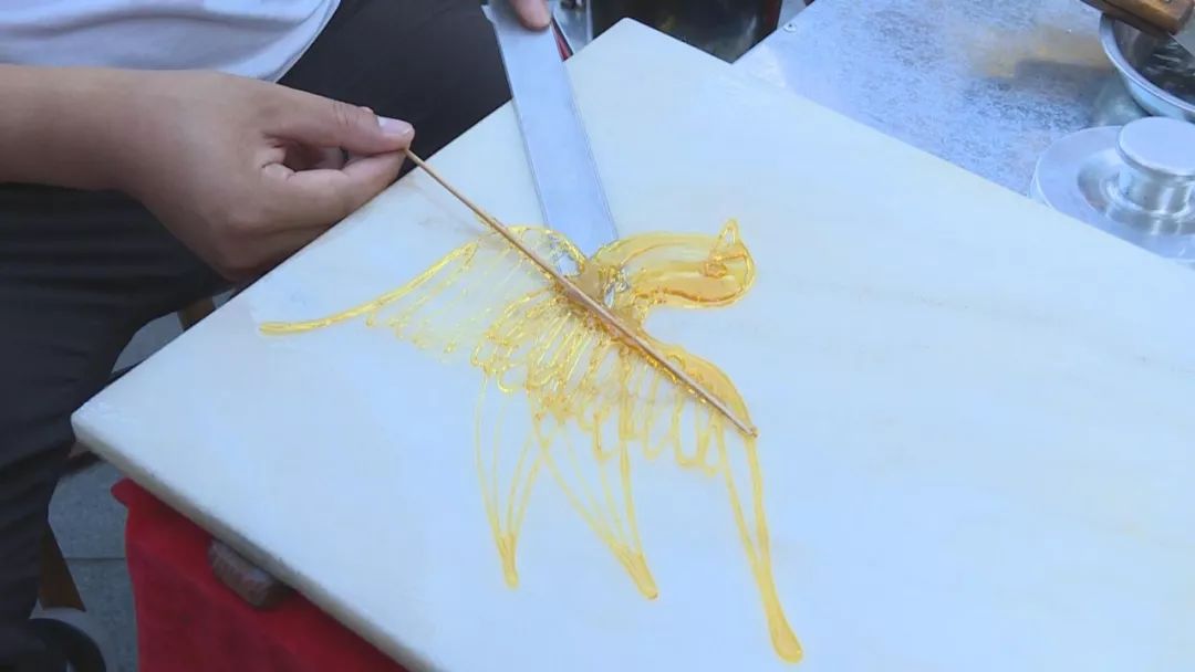 美食藏在情怀中略阳街头画糖人