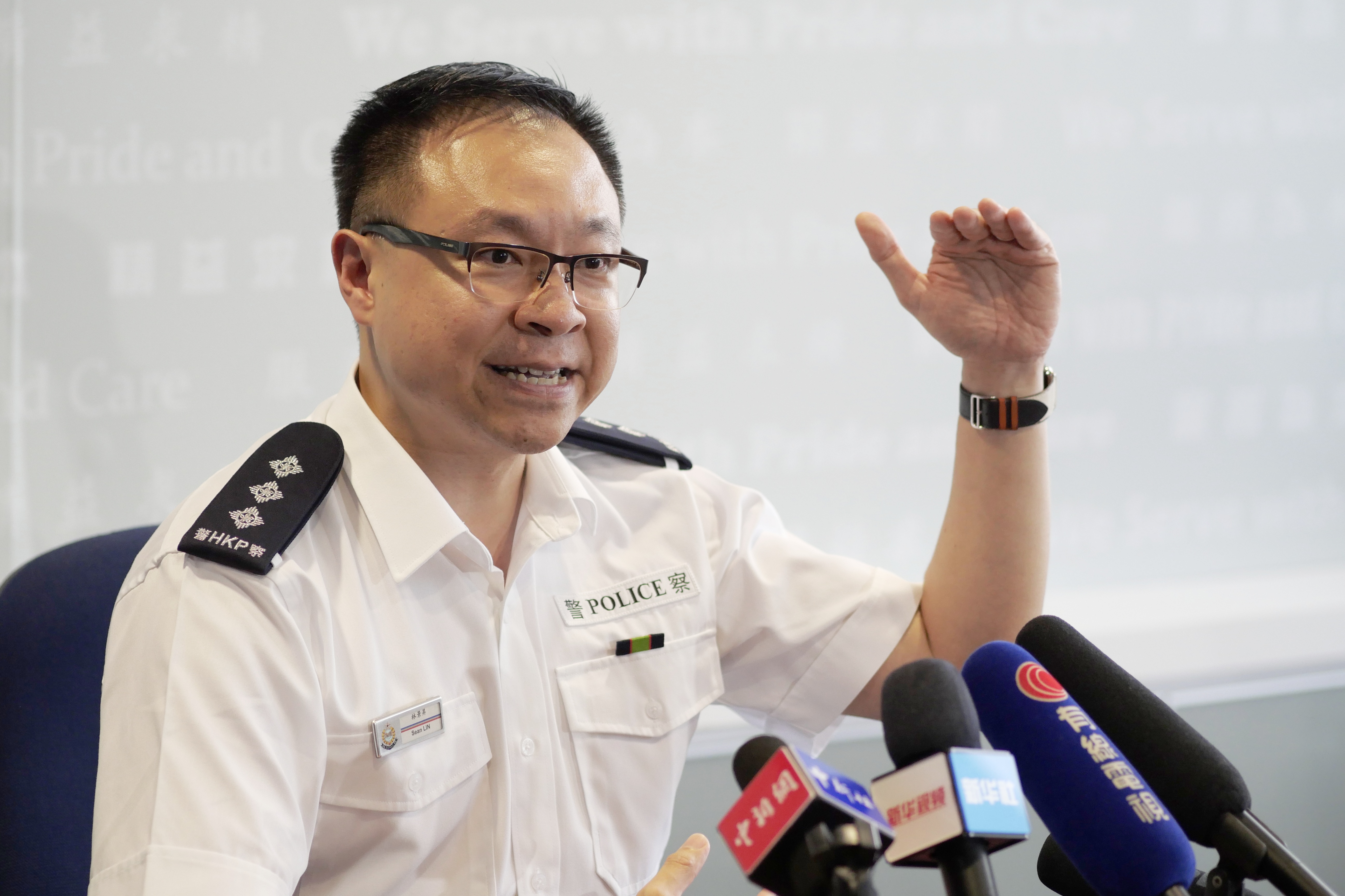 在香港警察总部,香港警务处沙田警区行动主任总督察,谈判专家林景升