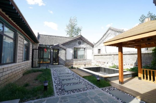 民宿关东客栈葫芦山庄田园风情酒店是以民国风情关东民俗为主题的住宿