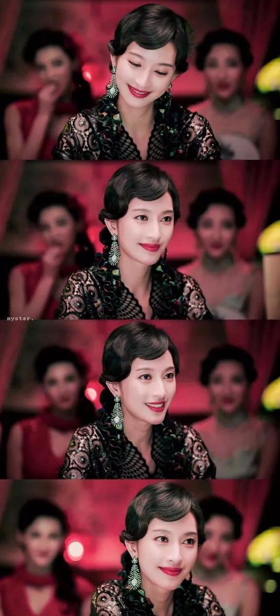 拉近看张俪的脸,浓烈的红唇,白皙的皮肤温婉的发型···总之照片里