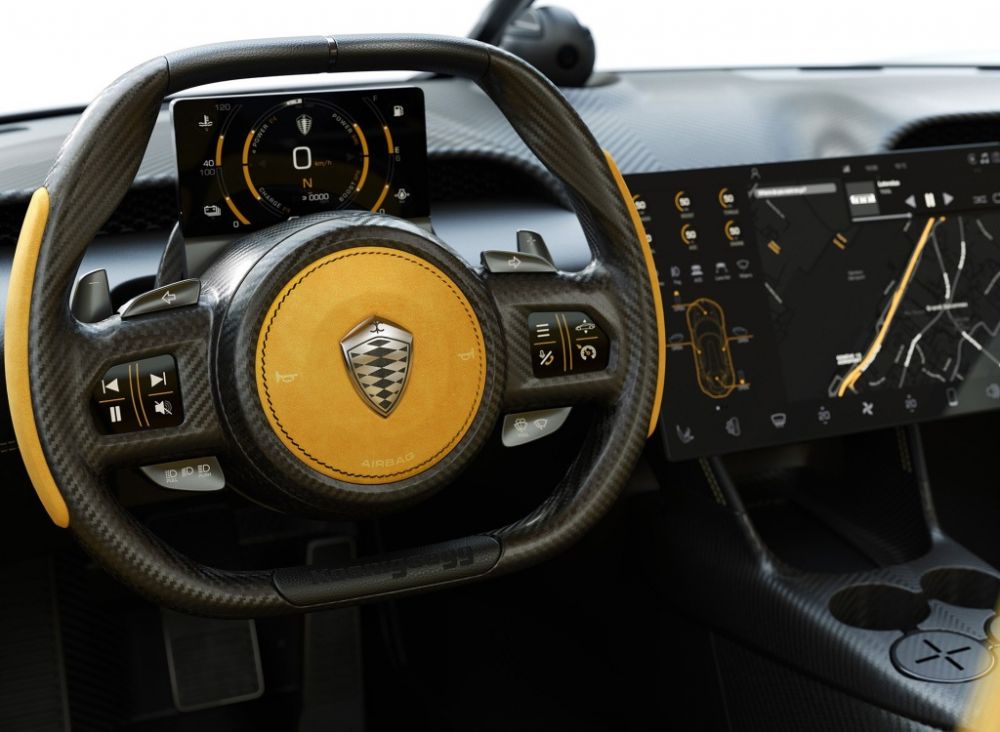 整个内饰的各个角落都充斥着碳纤维的元素,一眼望去只有中控台上一块