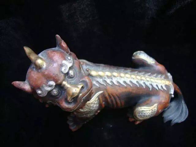 聚众物之优容为一体,虎头,独角,犬耳,龙身,狮尾,麒麟足