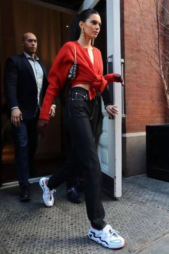 Noor de Groot wearing a vintage Fendi baguette and a blue suit